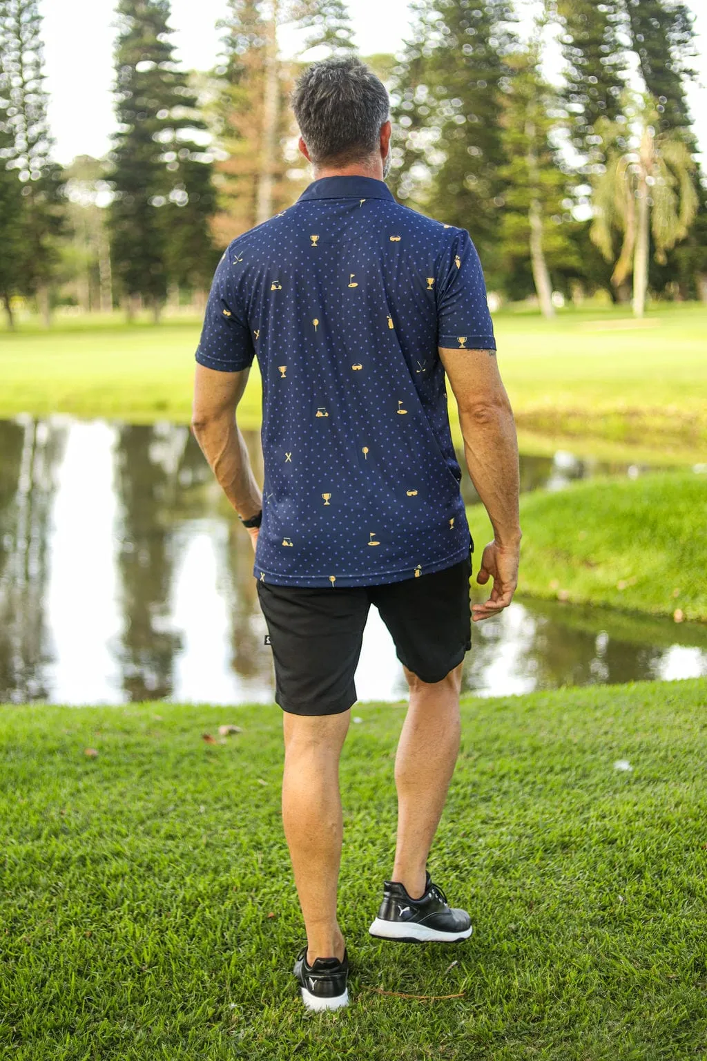 CA Statement Golf Shirt | Navy & Gold