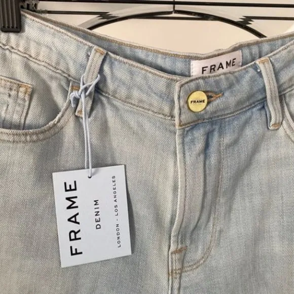 FRAME Denim light wash distressed shorts (NWT)