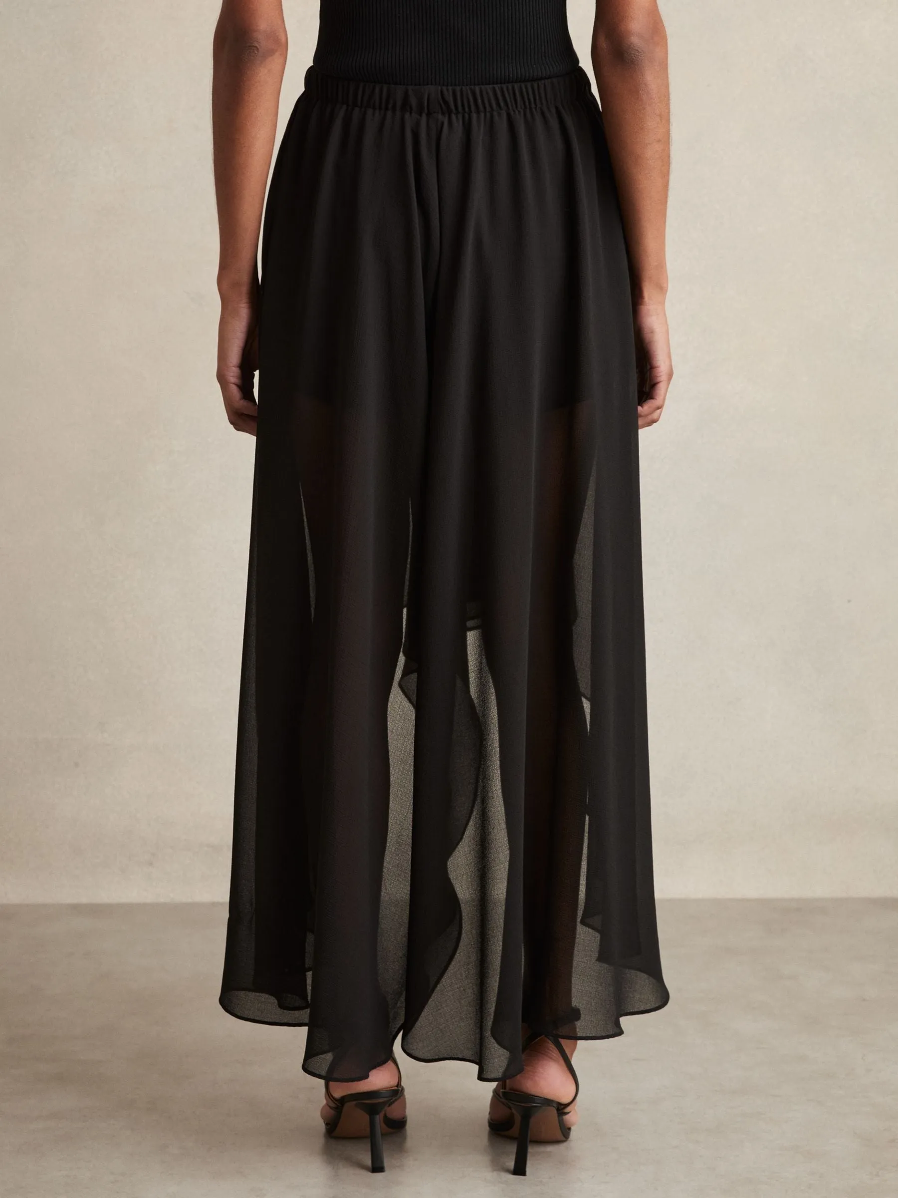 Sheer-Overlay High-Low Shorts in Black
